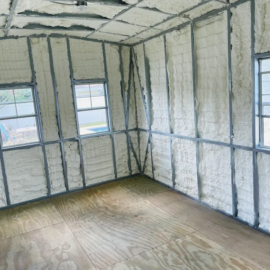 Closed-cell spray foam insulation applied to wall cavities in a residential project in Canal Fulton